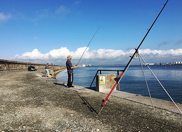 Fishing on the Holyhead breakwater on Anglesey