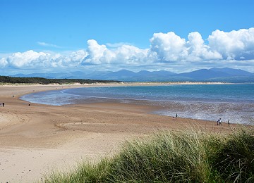 Newborough beach with Snowdonia in the distance