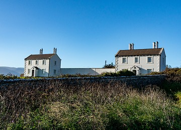 The two pilot houses once owned by Trinity house at Penmon Point
