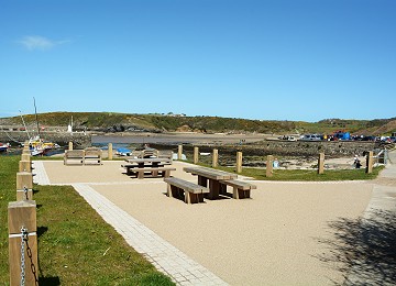 Picnic tables overlooking the cemaes bay beach