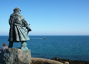 Dic Evans statue looks out at Moelfre lifeboat