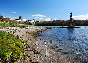 Tide in at Nelsons statue and Britannia bridge on the Menai Strait
